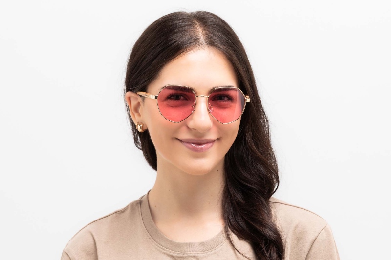 women wearing Elton sunglasses, geometric frames for square face shape, on a white background