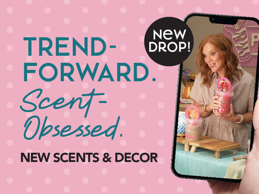 Woman holding a scented product with promotional text about new scents and decor.