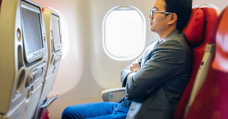 businessman sitting on an airplane