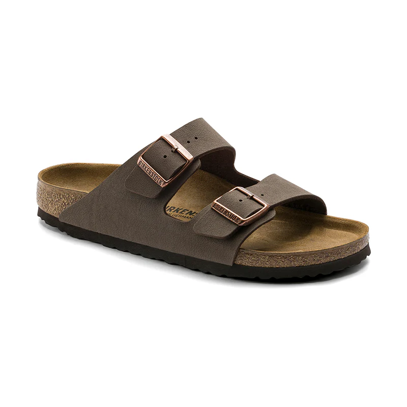 Brown two-strap sandal with a cork footbed and adjustable buckles.
