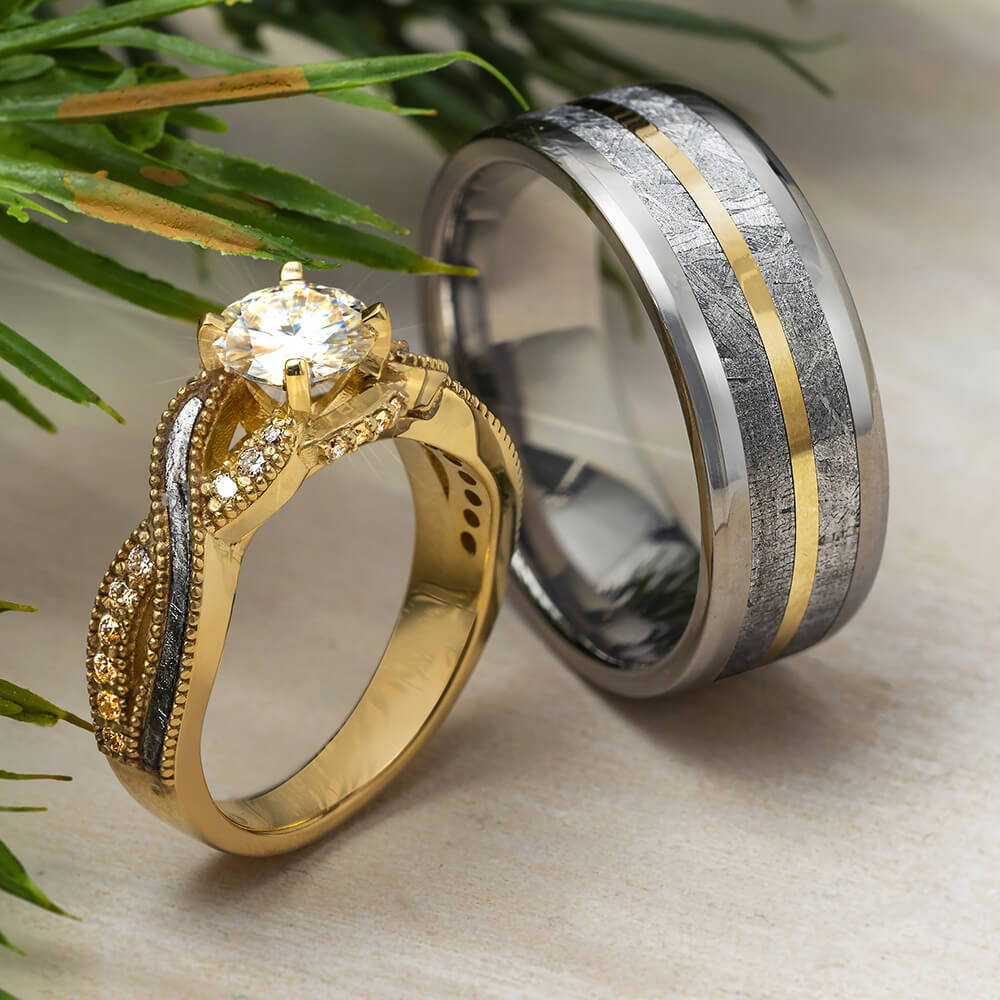 Matching meteorite engagement ring and wedding band in yellow gold