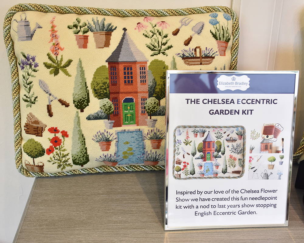 Finished Chelsea Eccentric Garden pillow with sign