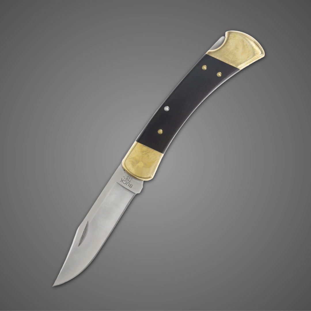 A folding knife with a black handle and gold accents.