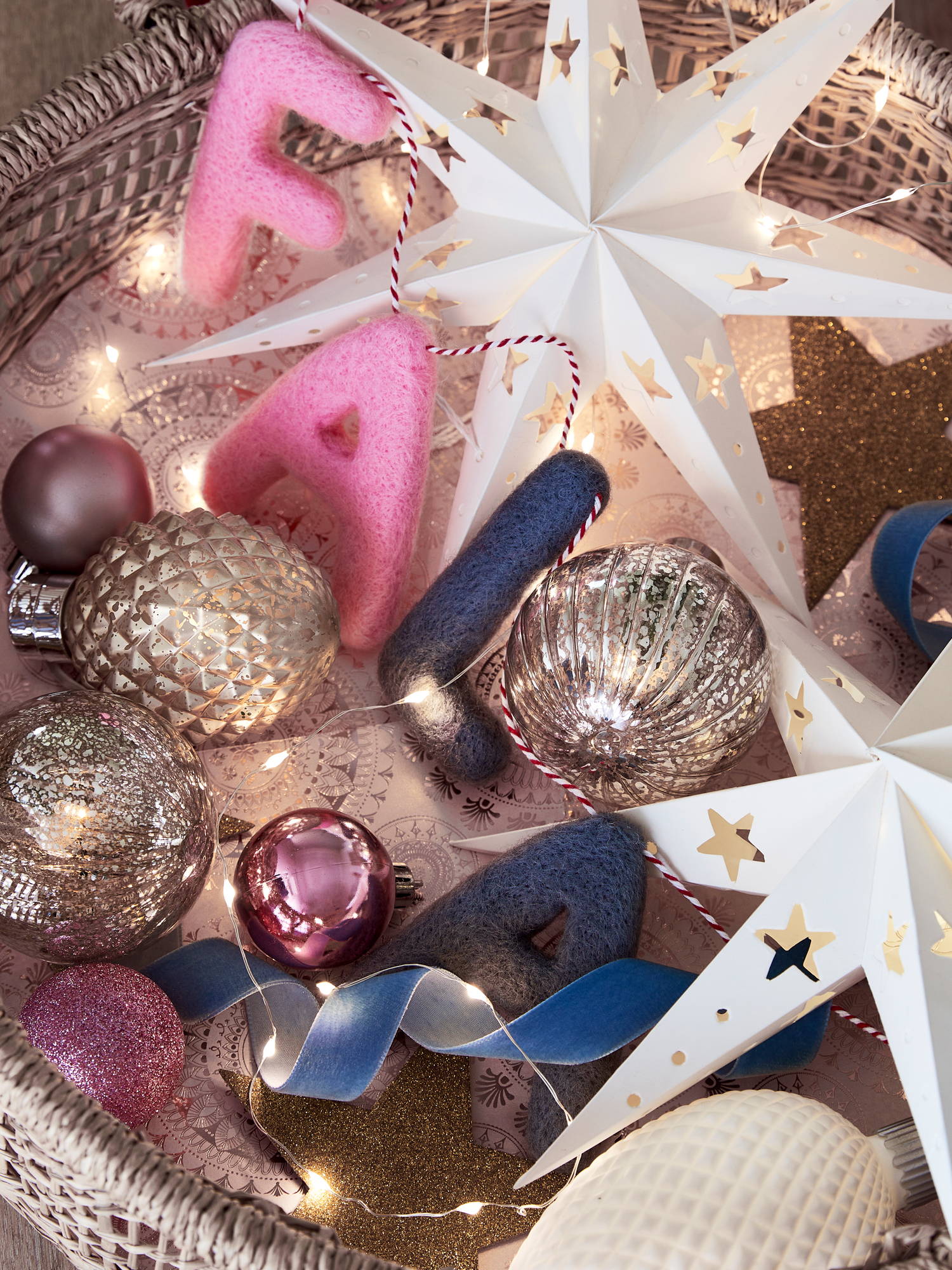 Falala felt garland with baubles, fairy lights and star paper lights.