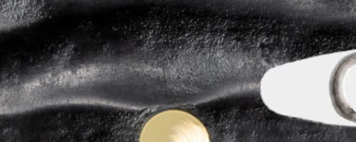 Abstract black and white texture with a golden circle and a white shape.