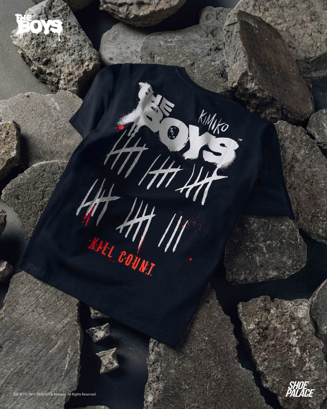 Black t-shirt with “The Boys” and tally marks design on rocks.