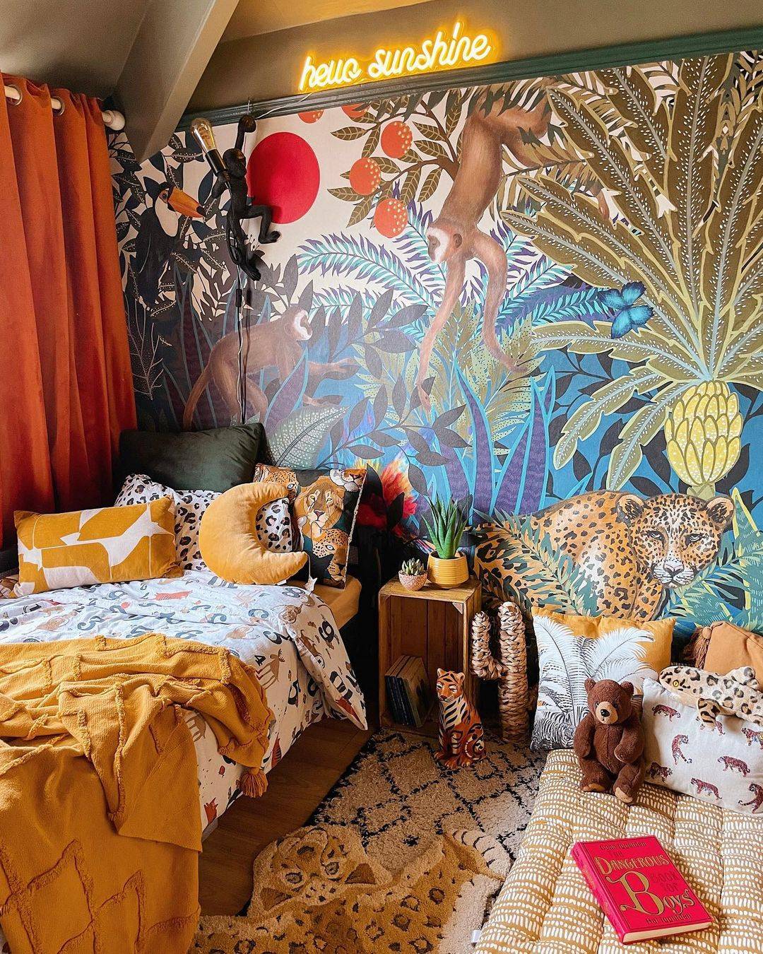 A jungle themed bedroom with a hello sunshine yellow neon light on the wall.
