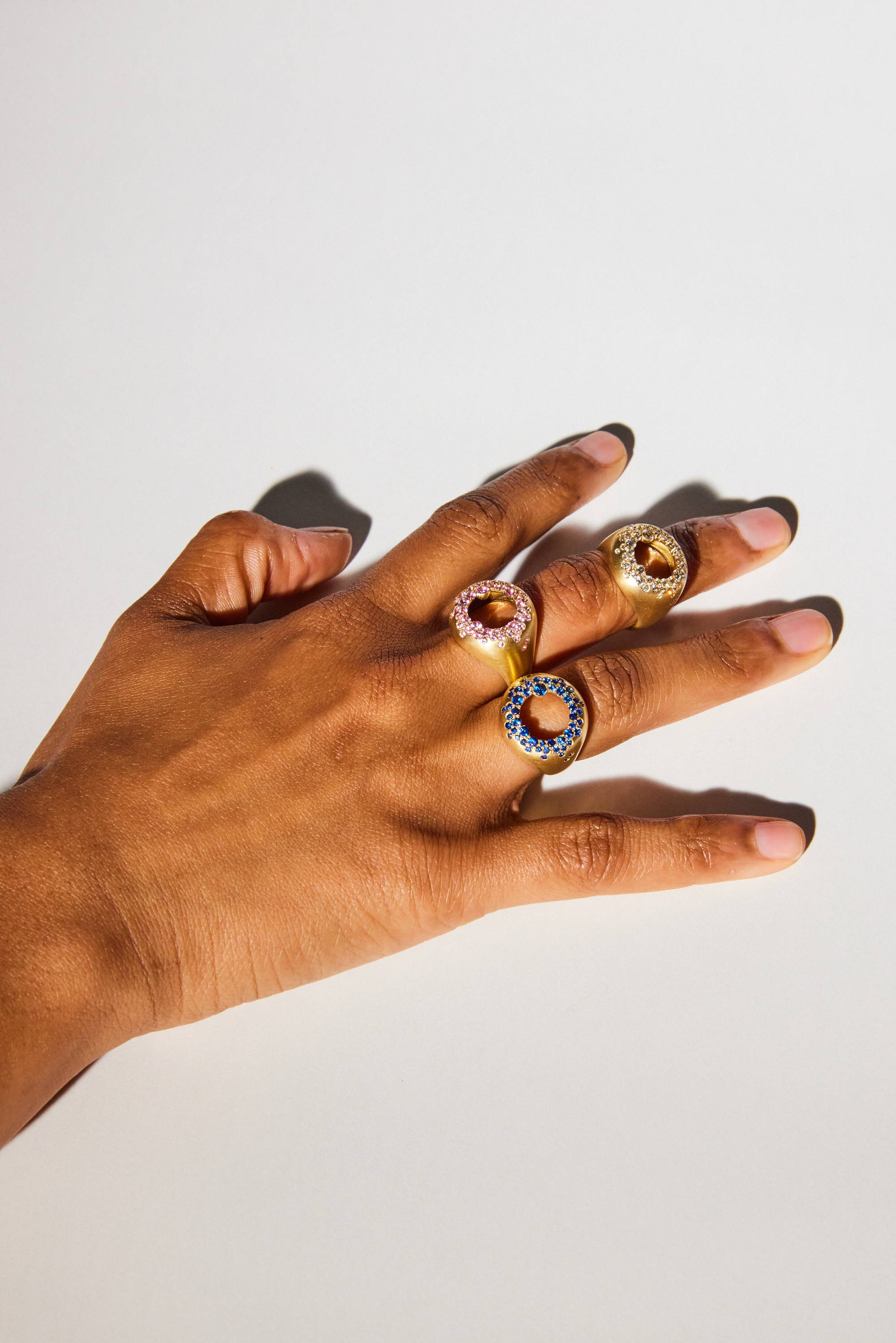 hand wearing three rings