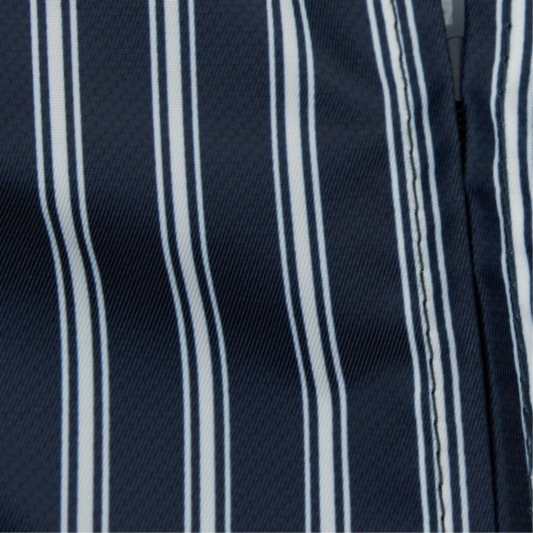 Close-up of navy fabric with white stripes.