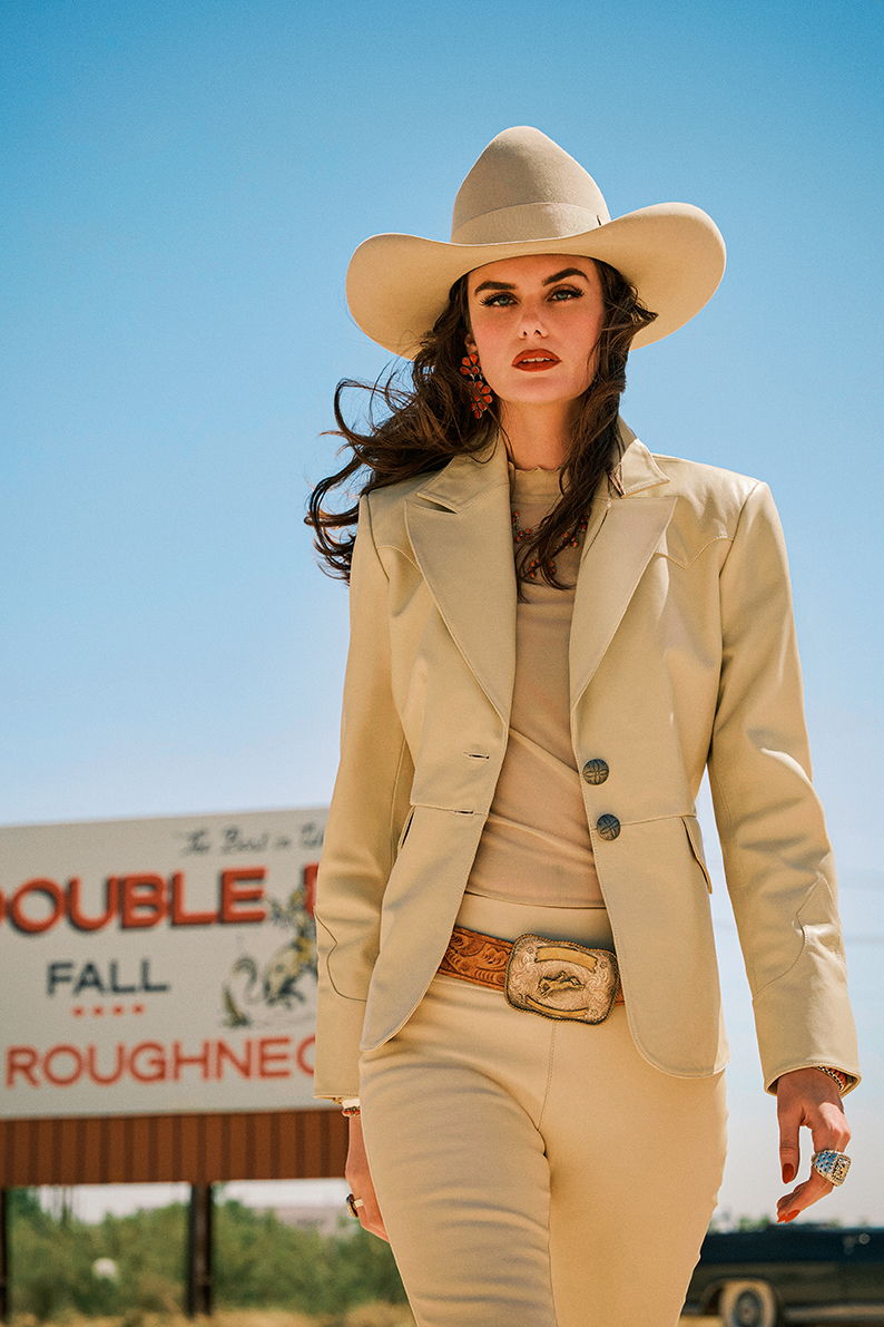 Kaylin wearing the Bandit Blazer and Pant with the Cassie tee and vintage Double D Ranch belt and hat.
