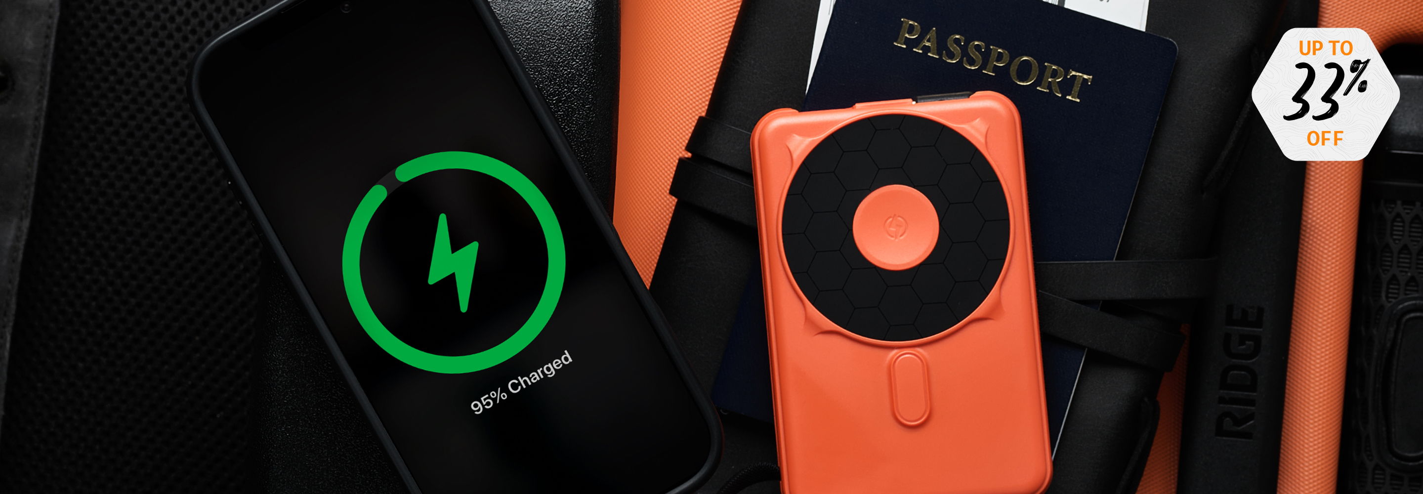 Smartphone charging wirelessly next to a passport and accessories.