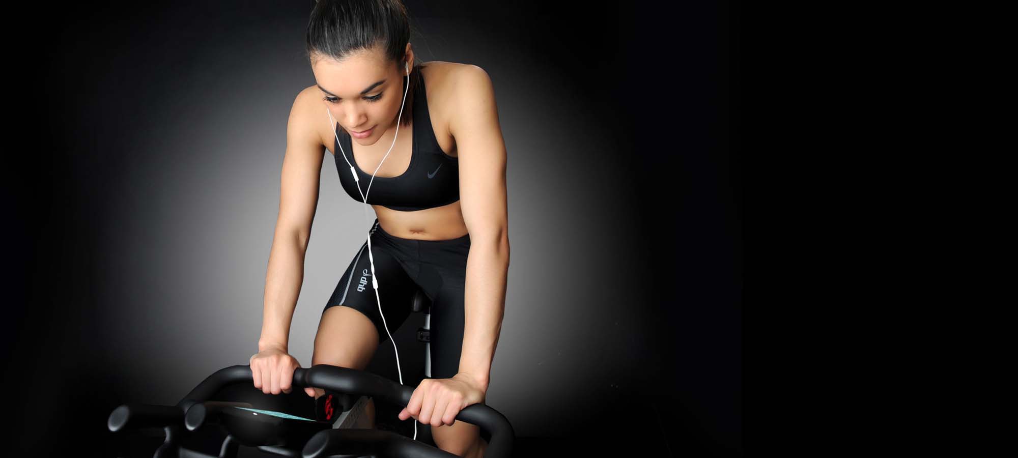 Female cycling on IC5 Indoor Cycle