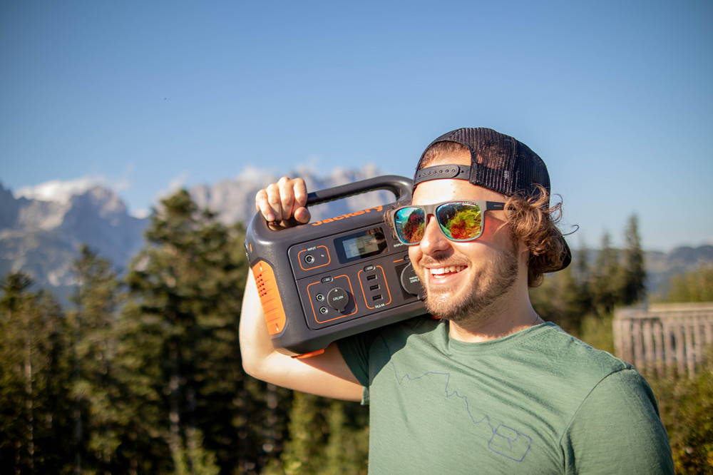 The Jackery Explorer Portable Power Station Lightweight Carried on Man's Shoulder