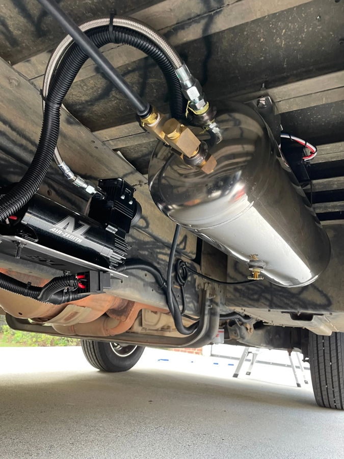 Undercarriage HornBlasters polished air tank and Air-Zenith compressor mounted on Bryan's step van frame photo 5