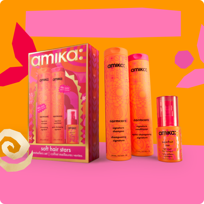 Amika hair care products in vibrant packaging on a colorful background.
