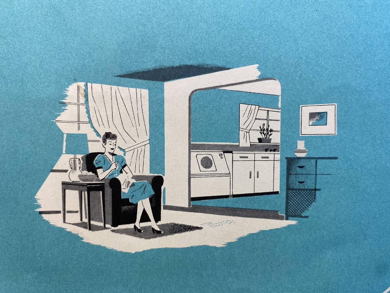 An illustration from a Mid-Century washing machine brochure featuring a woman sitting in an armchair in a living room . She is working on a sewing project in front of a window which is shining light into the room. There is an entryway to her left which leads into the kitchen. A washing machine and sink can be seen near a window with drapery.