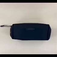Black rectangular bag on a light surface.