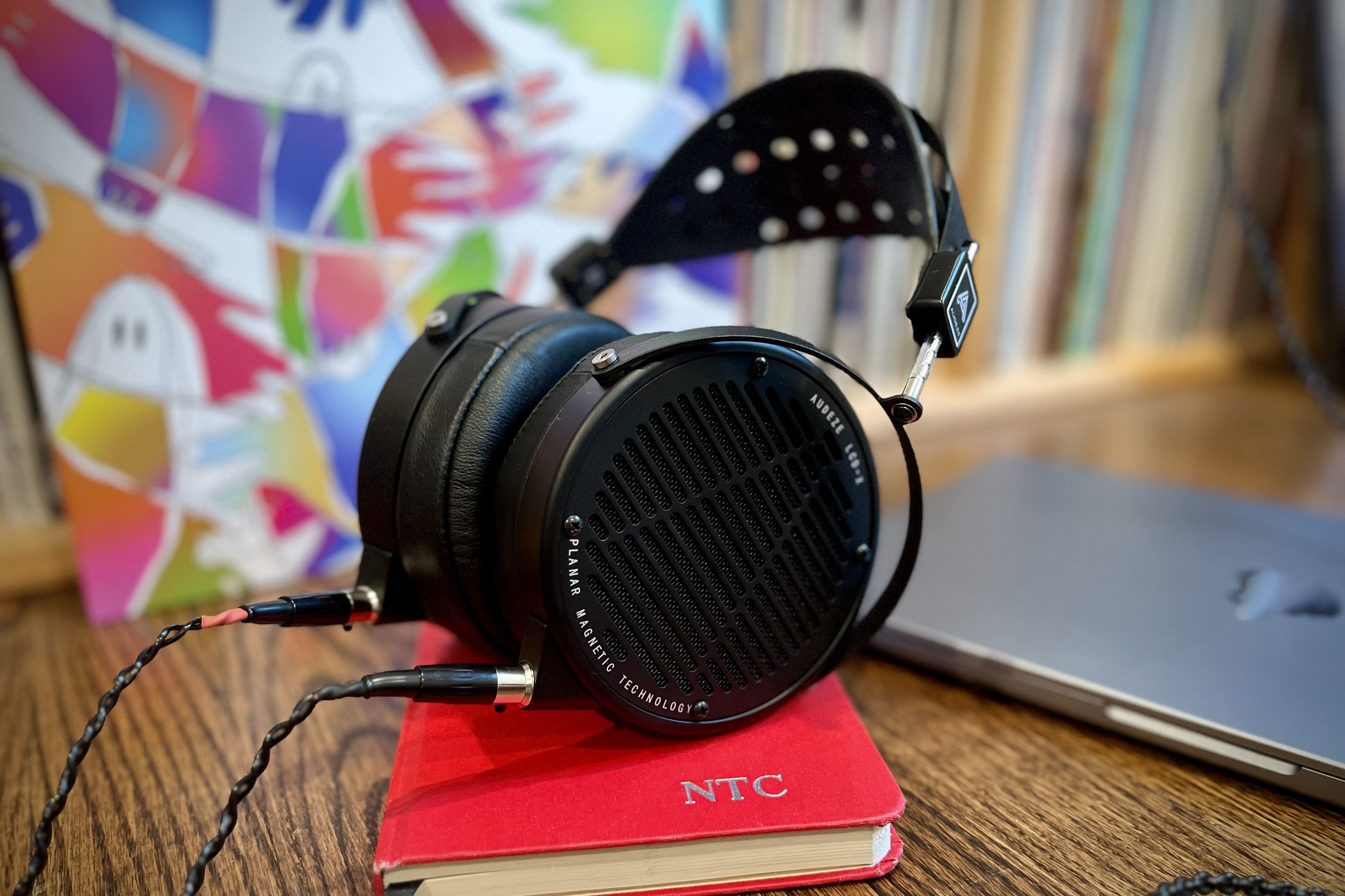 Audeze LCD-X headphones sitting on desk on top of journal 