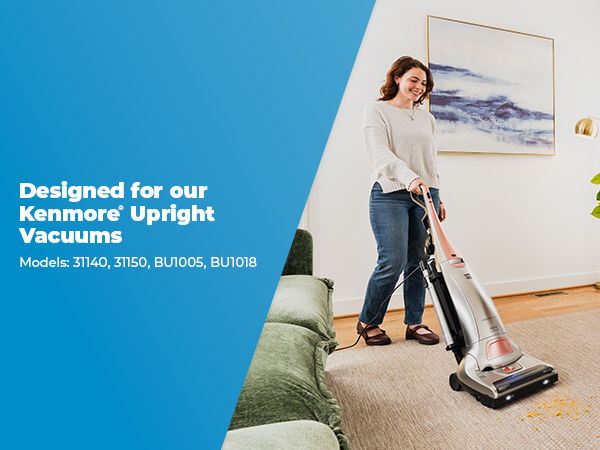 Woman vacuuming a carpet with a Kenmore upright vacuum.