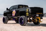 Rear three-quarter view of black lifted Silverado 2500HD thumbnail