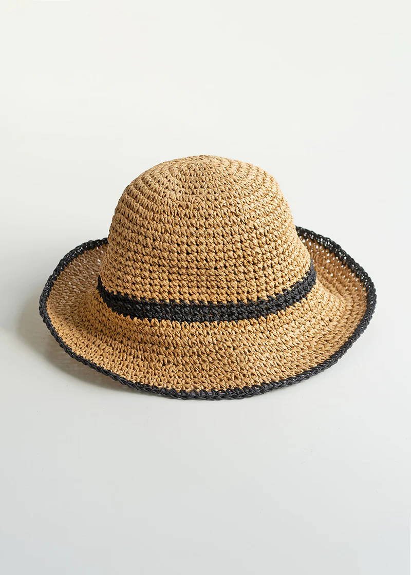 A 70s inspired crochet sun hat with black rim details