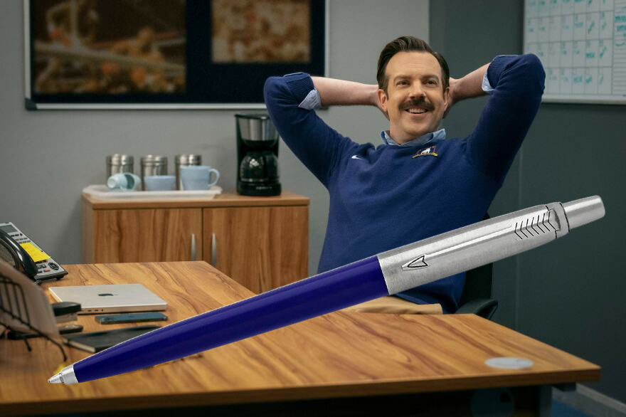 ted lasso with a parker jotter blue ballpoint pen