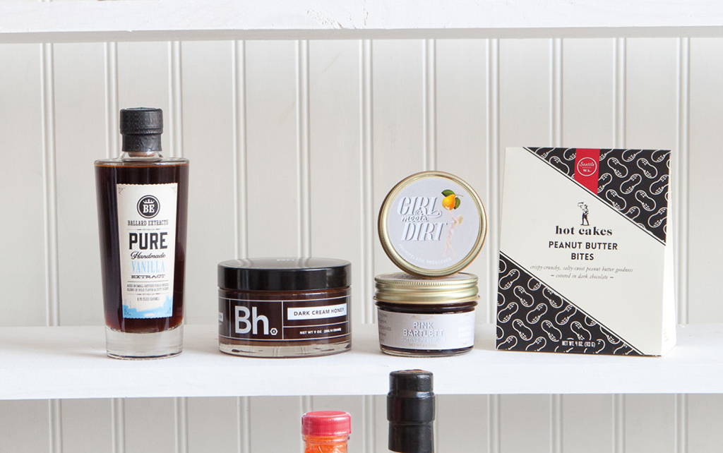 Four items are lined. upon a shelf. Girl Meets Dirt Cutting Preserves are featured. 