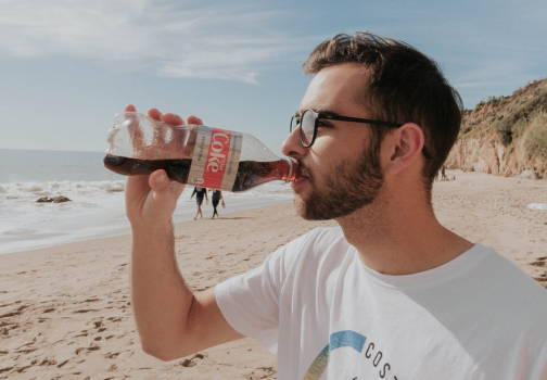 Drinking diet coke on the beach