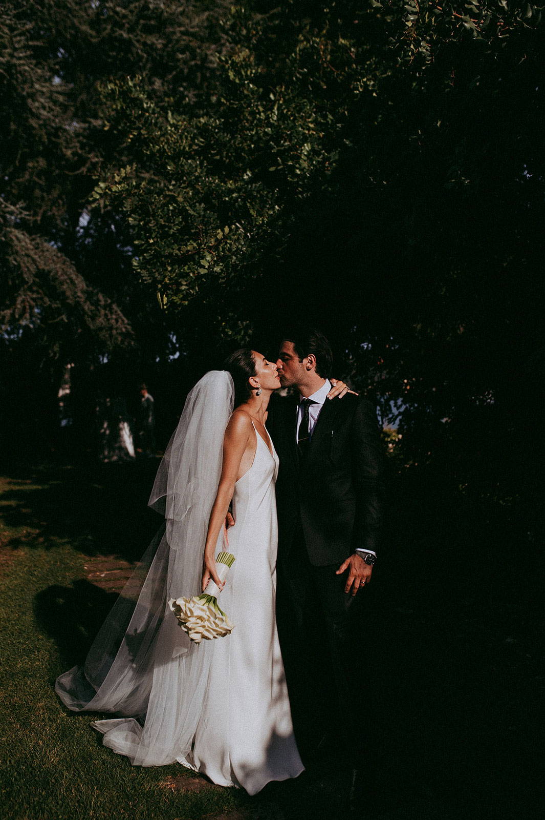 Bride and groom kissing