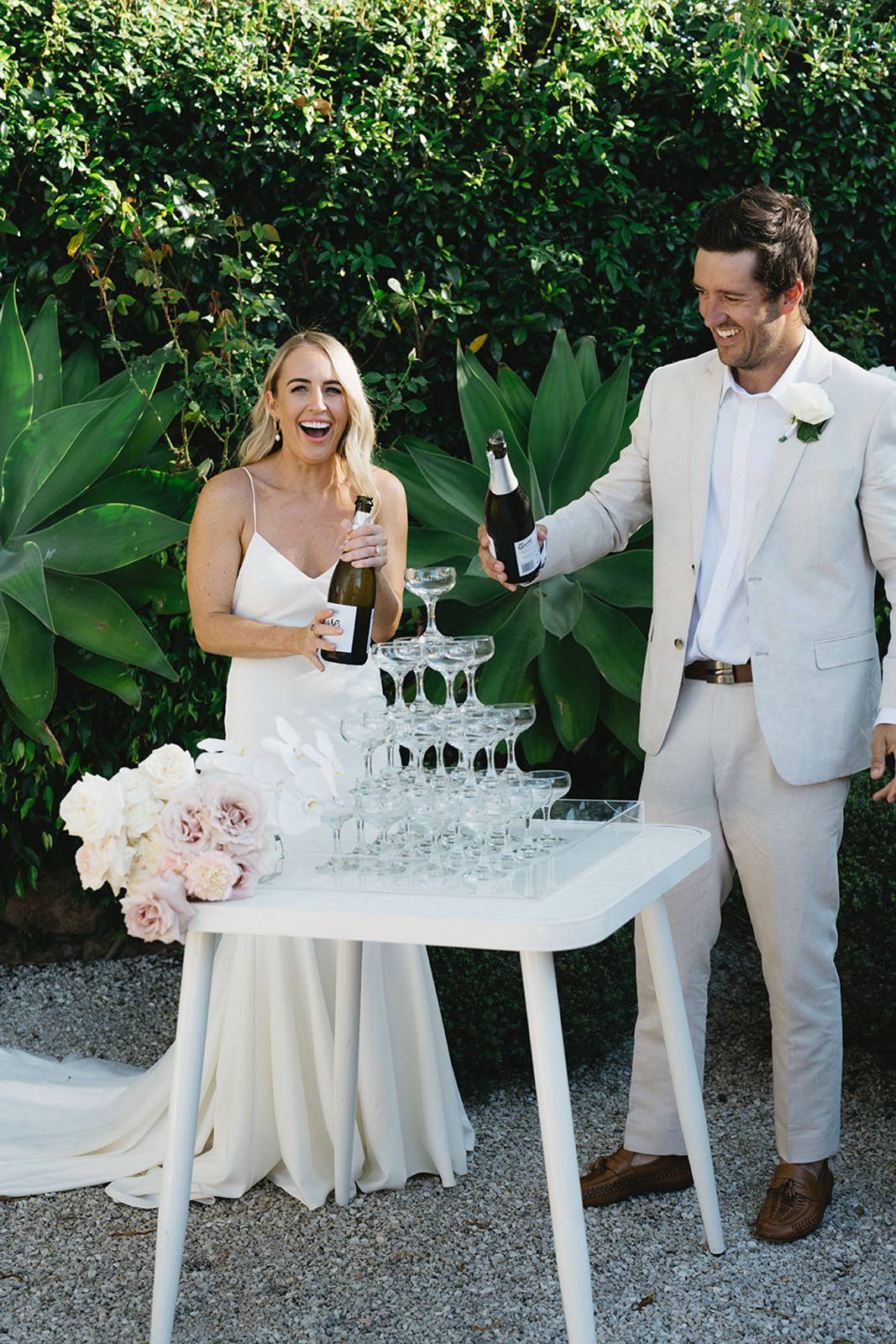 Bride and groom, cutting their wedding cake