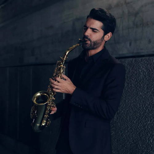 Manu Brazo playing alto saxophone