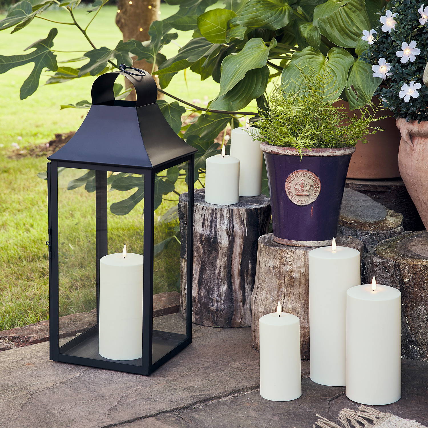 Close up of an outdoor lantern with a series of outdoor waterproof candles