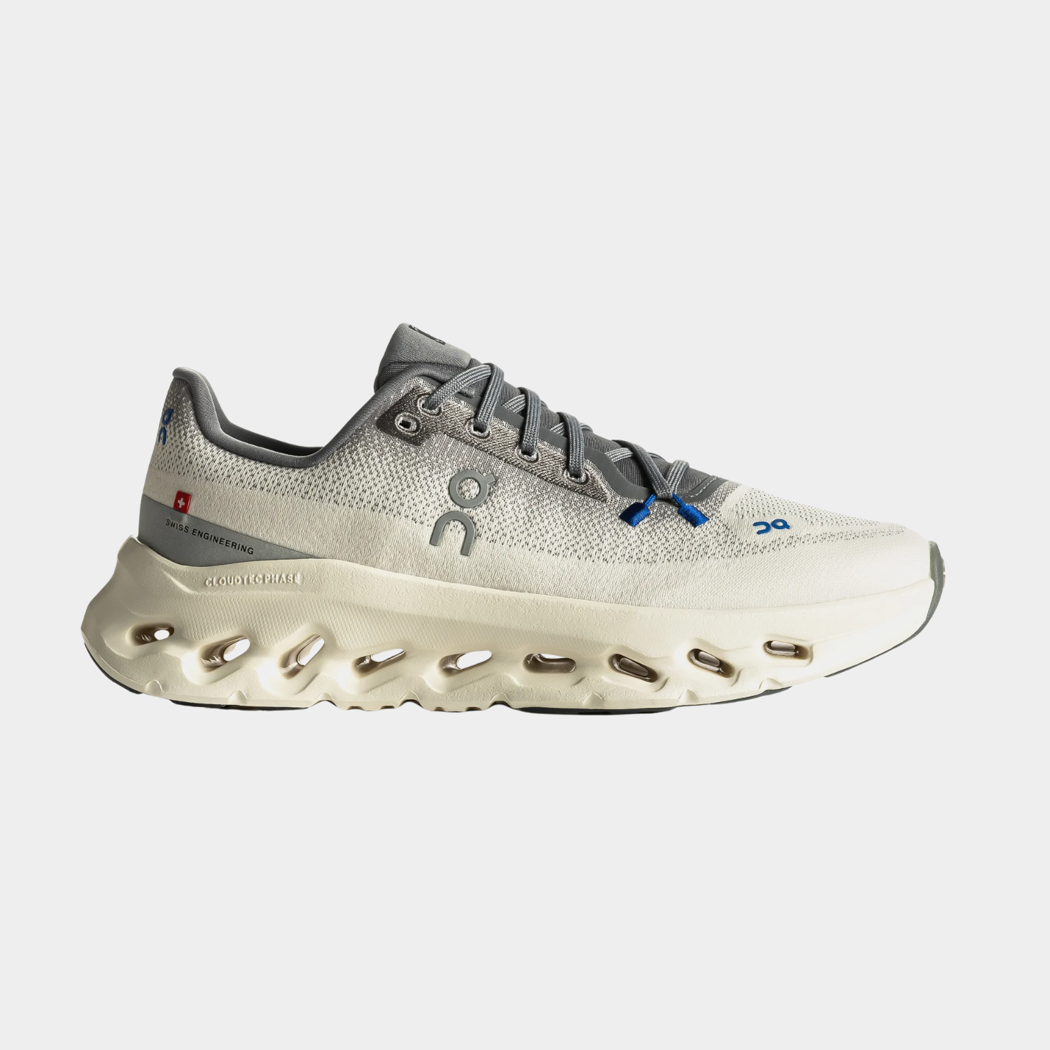 Grey athletic shoe with a unique sole design and blue accents.