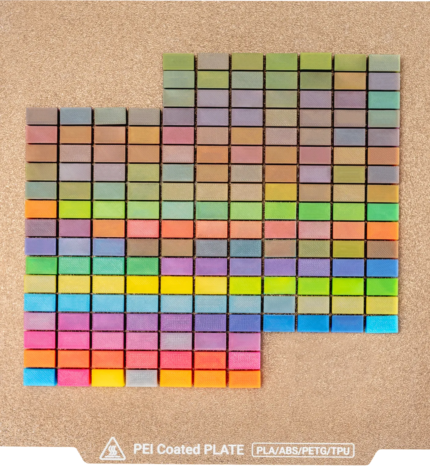 Colorful grid of small tiles arranged on a textured surface.