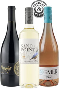 Three wine bottles: red, white, and rosé.