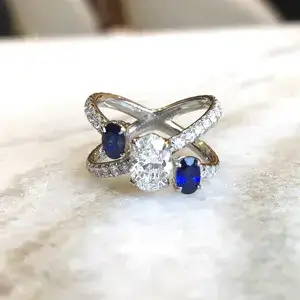 diamond and sapphire three stone engagement ring