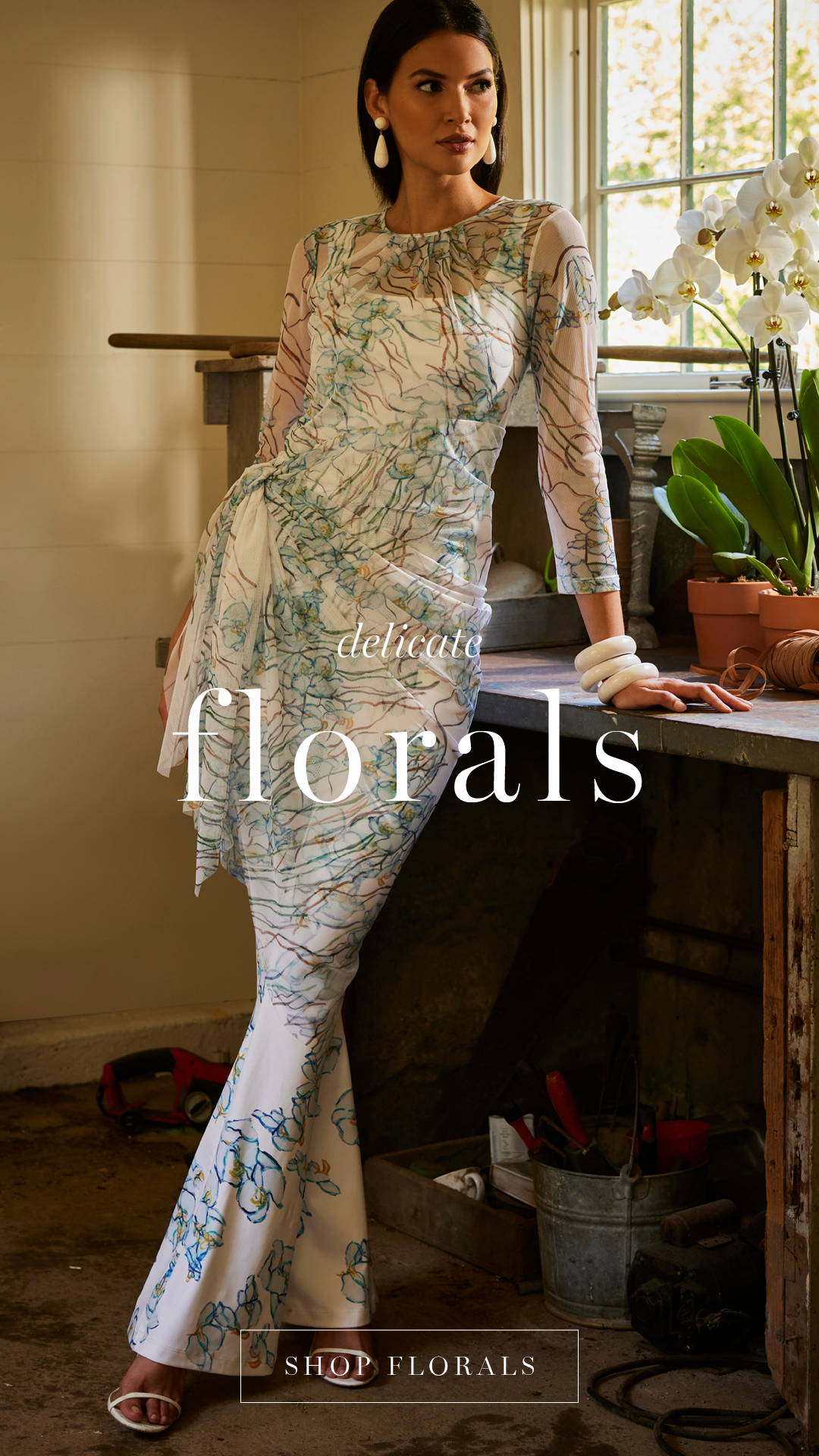 delicate florals | Woman wearing white floral tank top. andpants with mesh dress topper cover up | Shop florals