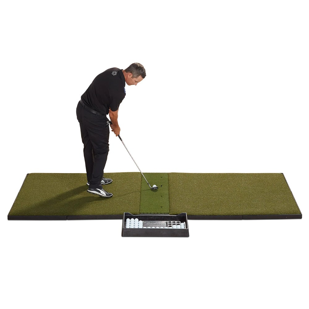 Man swinging on a Fiberbuilt golf mat