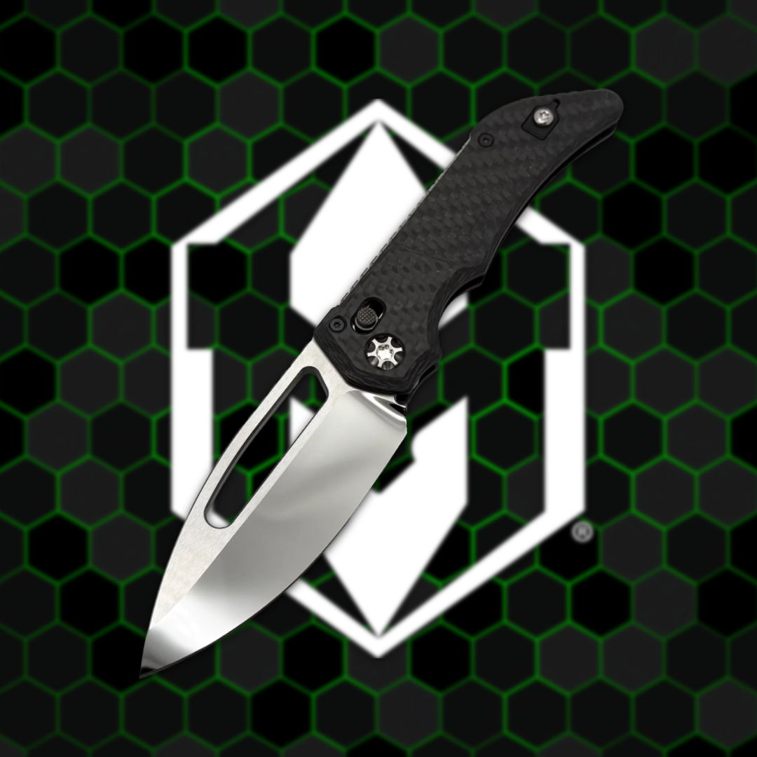 A sleek folding knife on a hexagonal patterned background.
