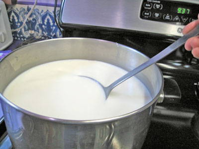 milk in a pot for cheese making