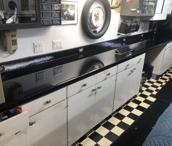 Black tinted epoxy over a laminate garage workbench with silver speckles