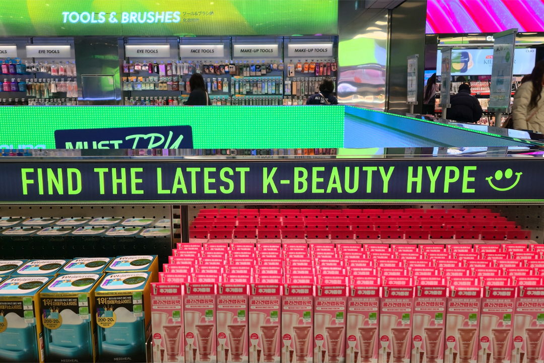 Display promoting K-beauty products in a retail environment.