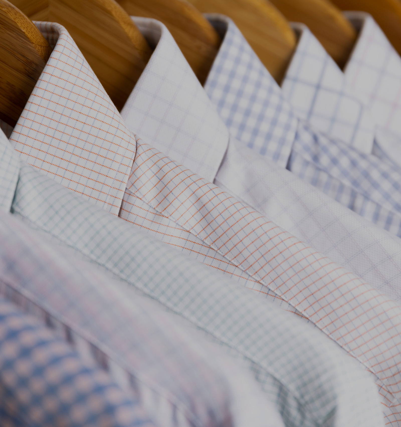 Up close of new Spring dress shirts on hangers 