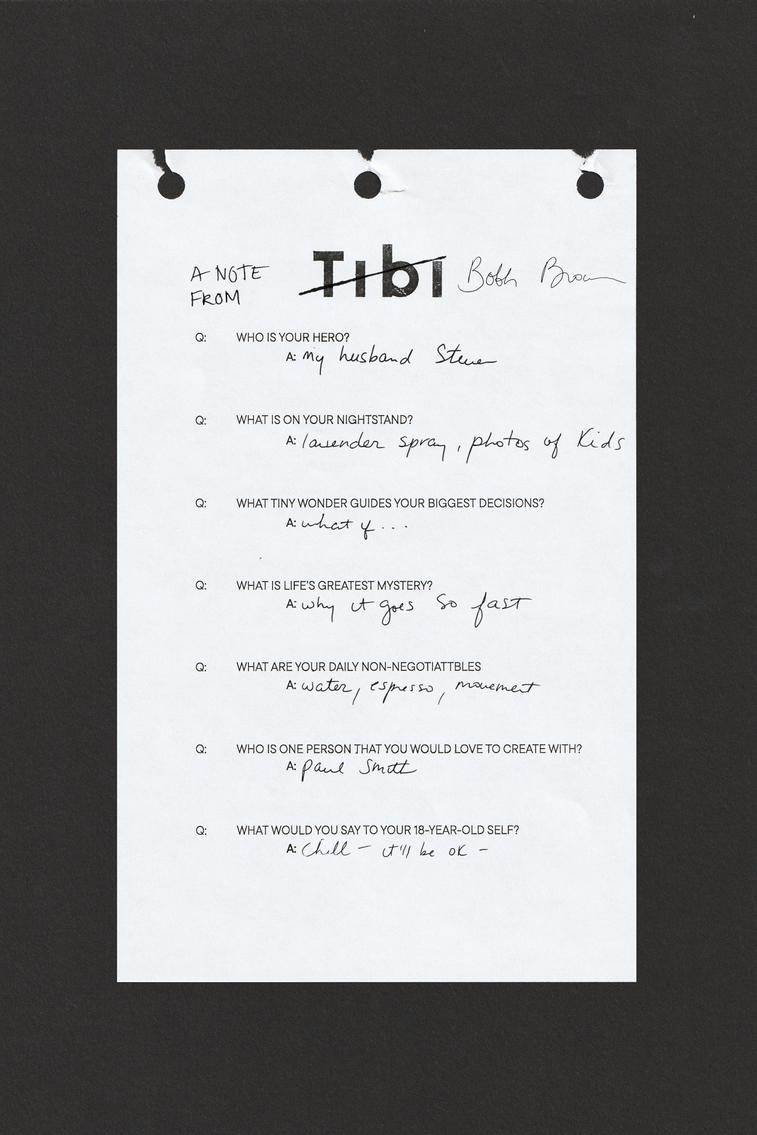 A handwritten note on a white paper with questions and answers.