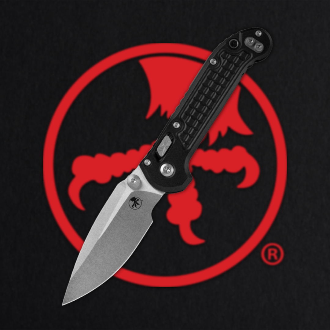 A folding knife with a black handle on a red background.