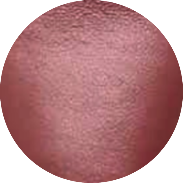 Circular swatch of rose-colored textured cosmetic product.