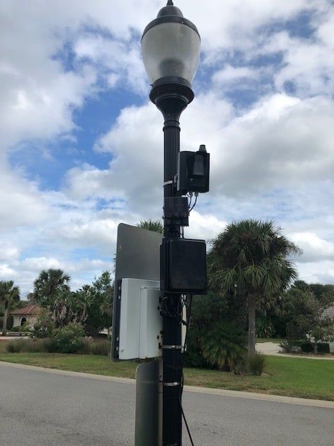 Speed camera mounted with a radar speed sign on a residential street