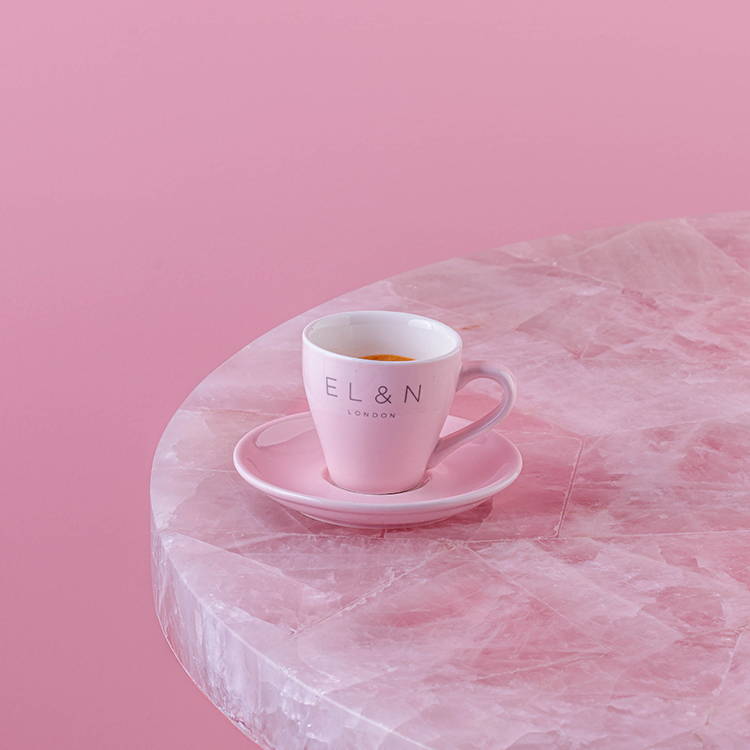 Cortado coffee on pink background