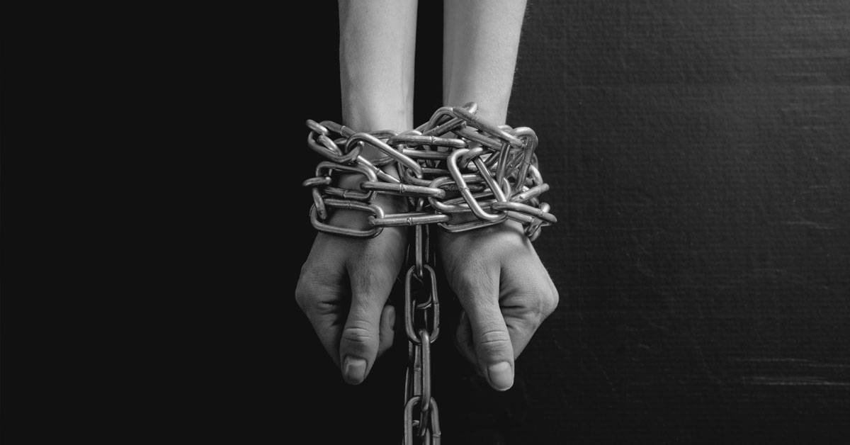 Hands bound in chains