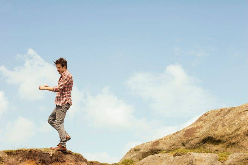 Man Standing On Rocks